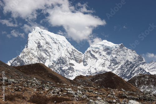 Cholatse and Taboche snow mountains above grass hills, Himalaya, Nepal © Alexander Zotov