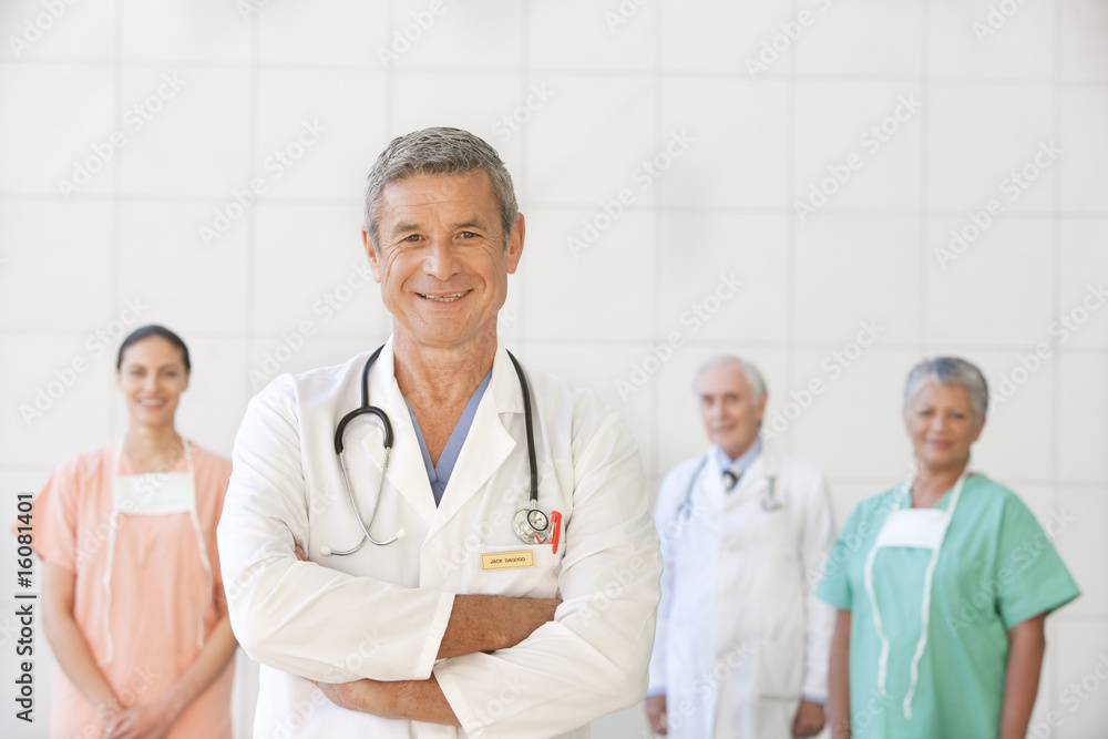 portrait of senior doctor with staff portrait of senior doctor with staff