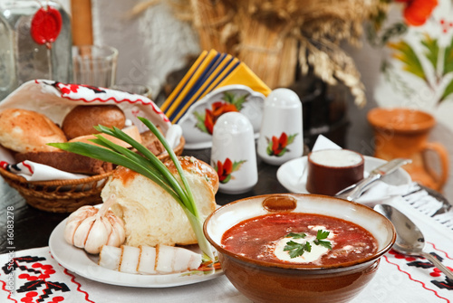 Ukrainian borsch, red-beet soup with pampushki, lard and garlic photo