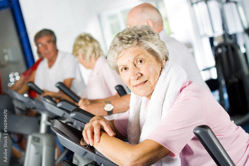 Older people exercising in the gym Older people exercising in the gym