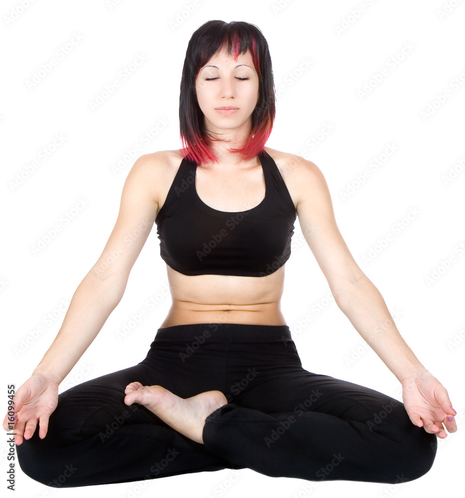 Woman meditating sitting in a yoga position Woman meditating sitting in a yoga position