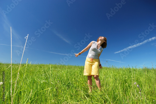 Young woman dancing on the field