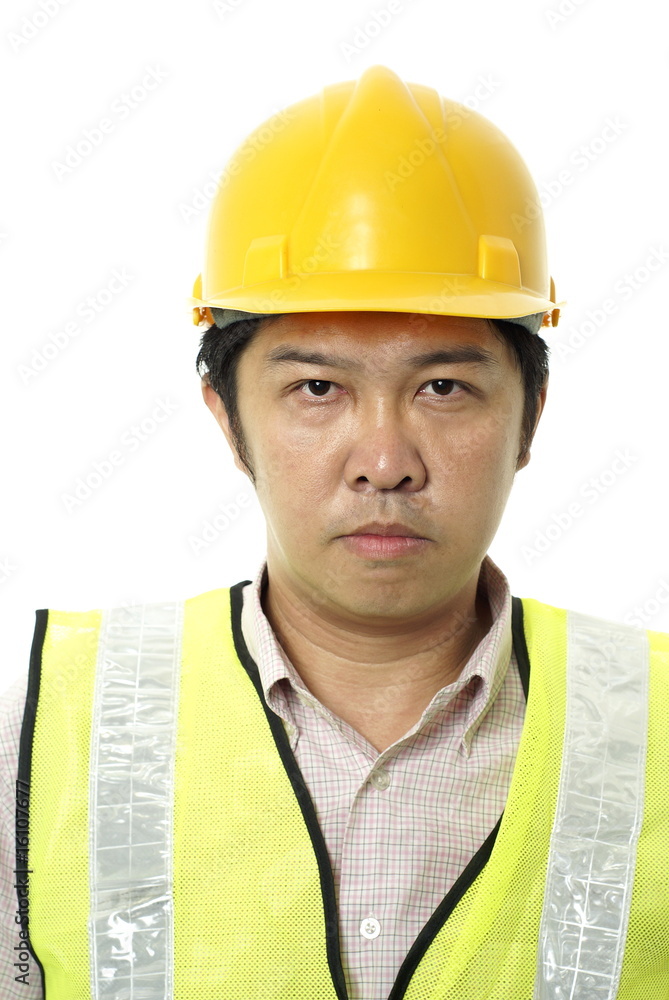 Asian construction contractor with blank expression Asian construction contractor with blank expression