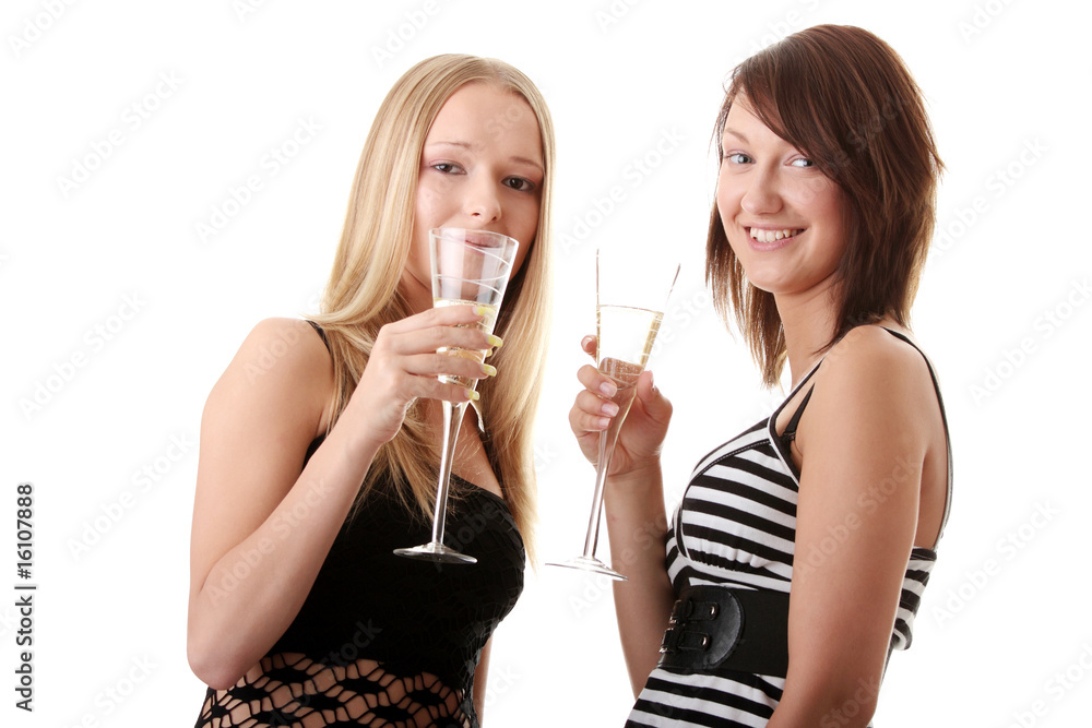 Two casual young women enjoying champagne Two casual young women enjoying champagne