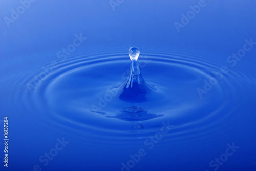 Waterdrop falling into water