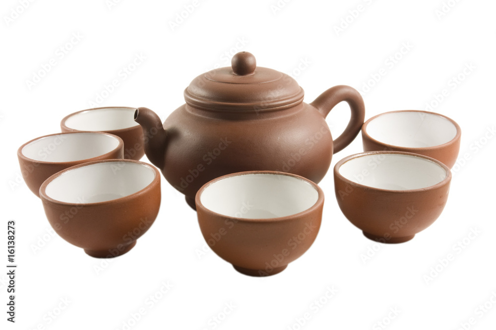 Chinese tea set surrounded by tea cups (Isolated)