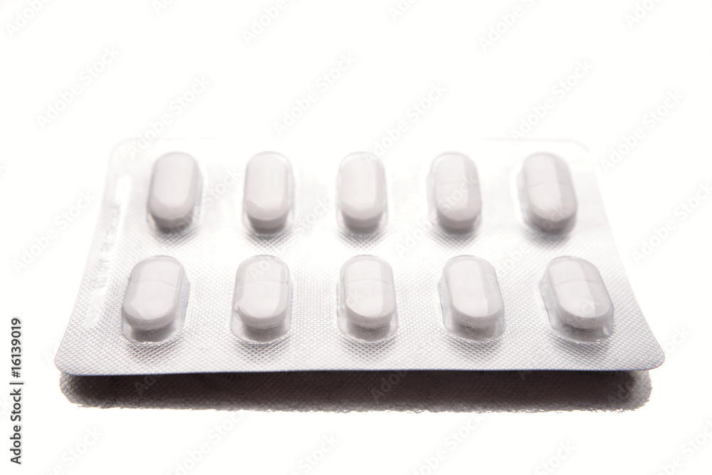 Pills in pack on white