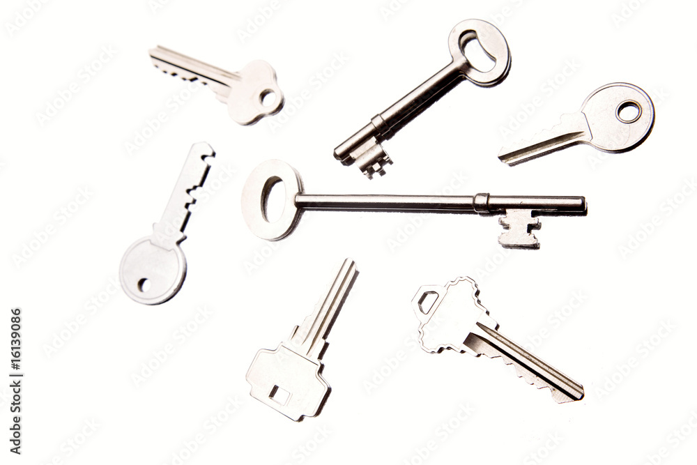 Seven assorted keys on white Seven assorted keys on white