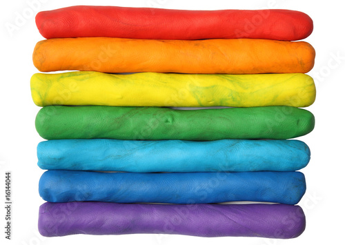 Rainbow colors plasticine play dough isolated over white. photo