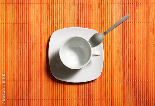 empty coffecup with spoon top view photo