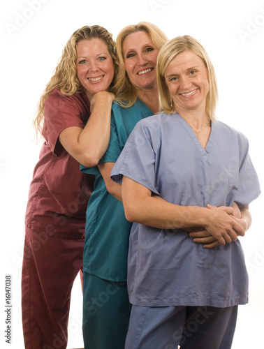 three  female doctors nurses in medical scrubs clothes
