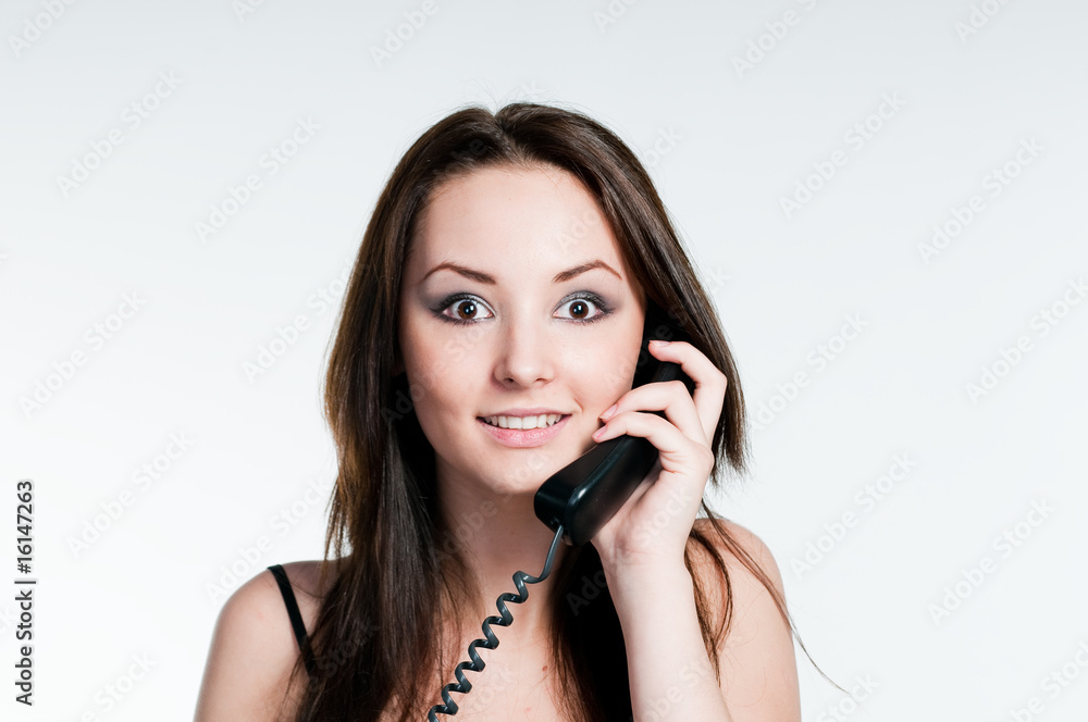 Surprised girl speaking on phone Surprised girl speaking on phone