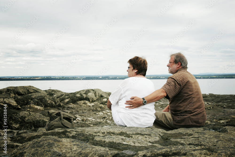 Couple discussing by water