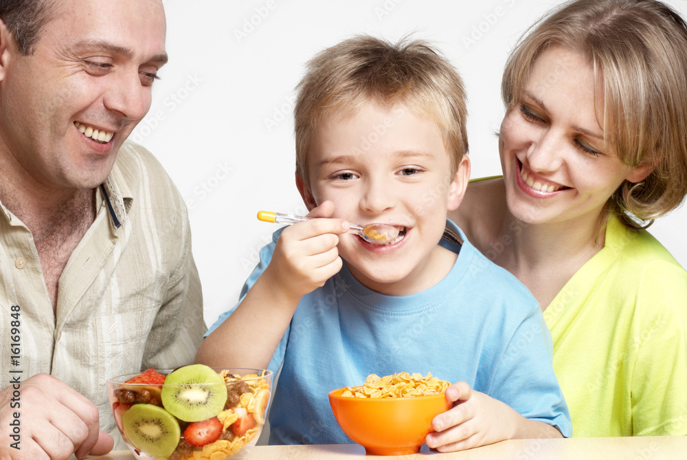 The happy family has breakfast The happy family has breakfast