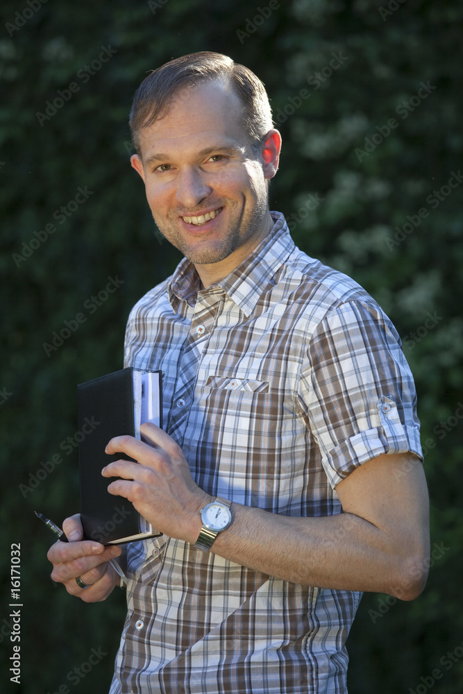 Fototapeta premium happy man with diary