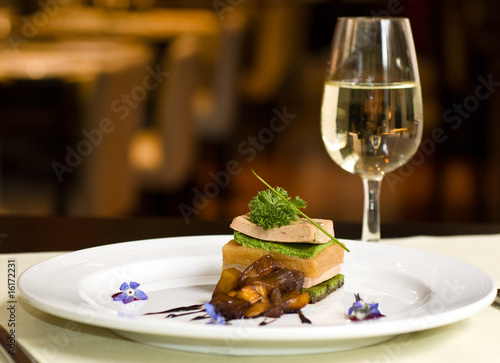 Quadro em tela Gourmet dish and white wine, restaurant.