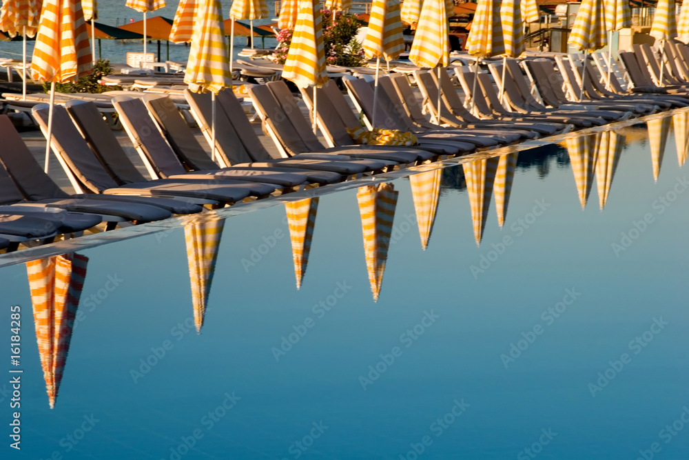 Umbrella reflections on the resort pool Umbrella reflections on the resort pool