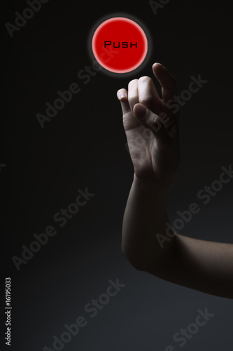 finger pressing the red button
