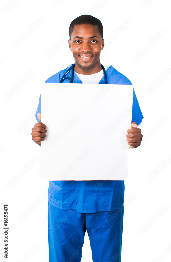 Handsome doctor wearing scrubs and showing a white card Handsome doctor wearing scrubs and showing a white card