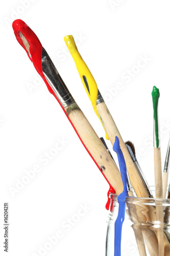 Paint brushes covered in paint
