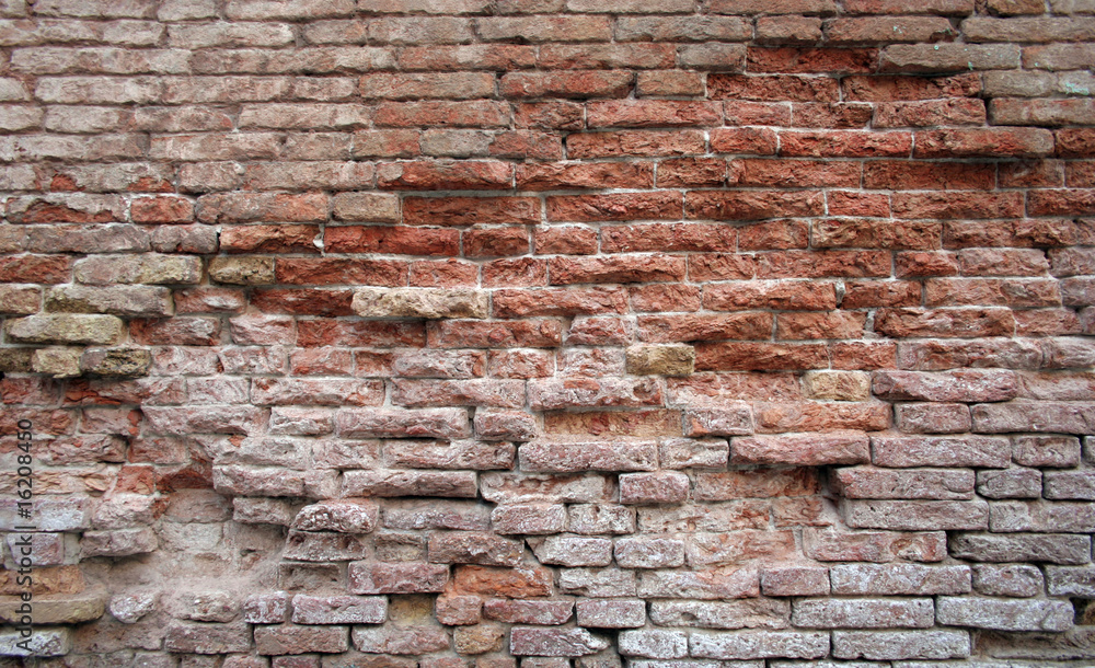 Obraz premium historical red brickwall damaged background