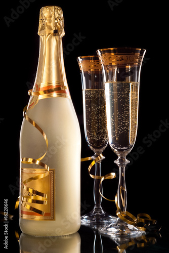 Glasses of champagne with bottle