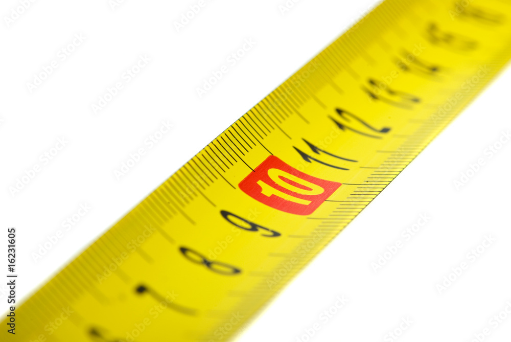 Close-up shot of yellow metal measurement tape Close-up shot of yellow metal measurement tape