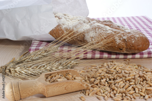 french bread with cereals on timber plate