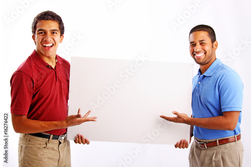 Фотография Two Men Displaying Poster