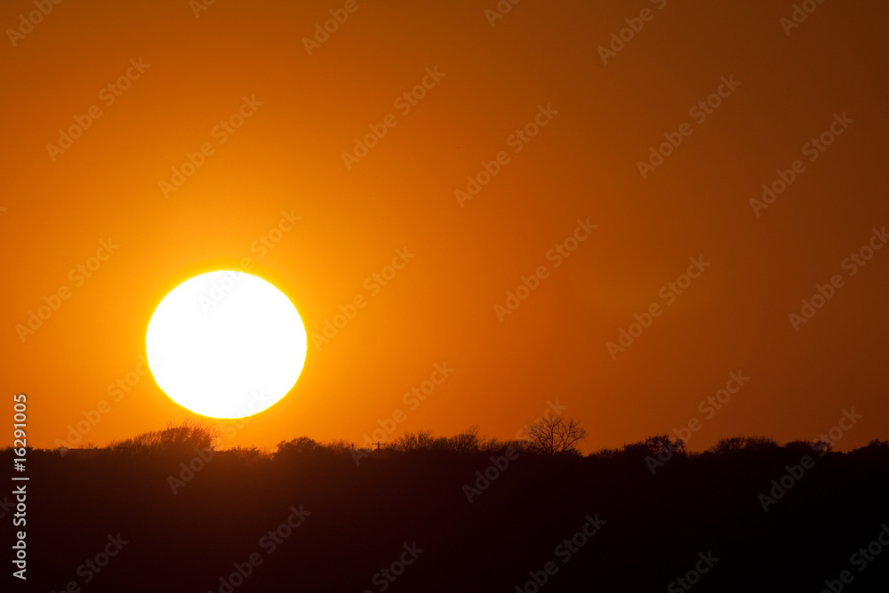 Large sun disc at sunset
