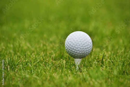 Golf ball in grass, close up
