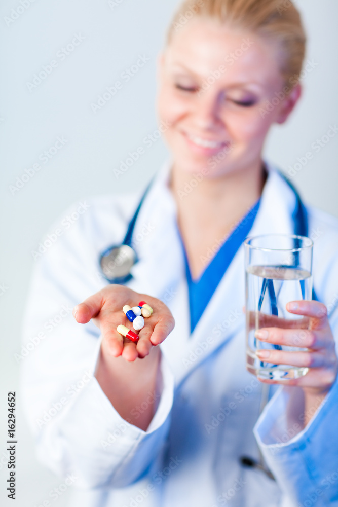 Doctor holding pills out Doctor holding pills out