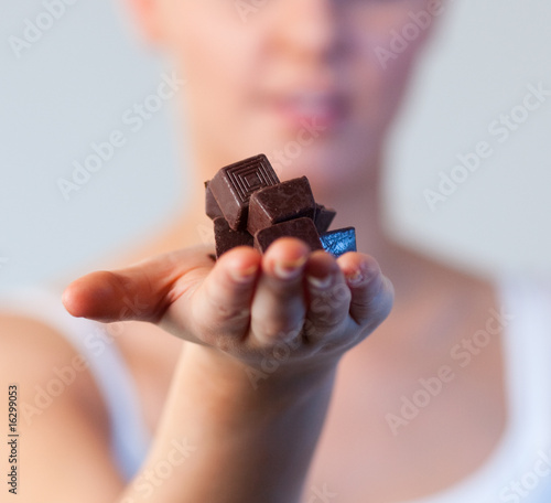 Vászonkép Close-up of an attractive woman holding chocolate