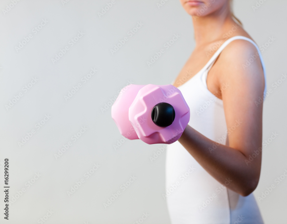 Beautiful woman trained with weights focus on weights Beautiful woman trained with weights focus on weights