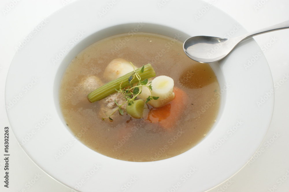 healthy soup with organic vegetables and a spoon healthy soup with organic vegetables and a spoon