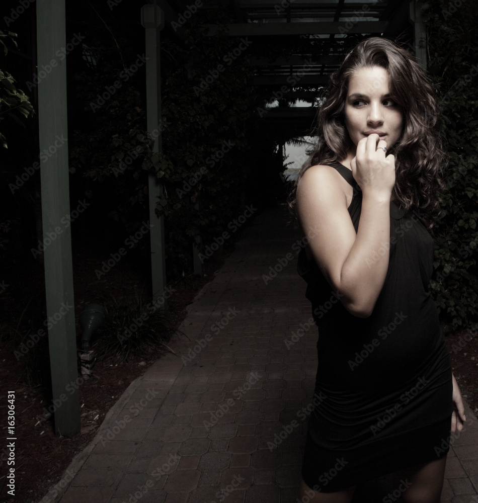 Beautiful young woman alone at night Beautiful young woman alone at night