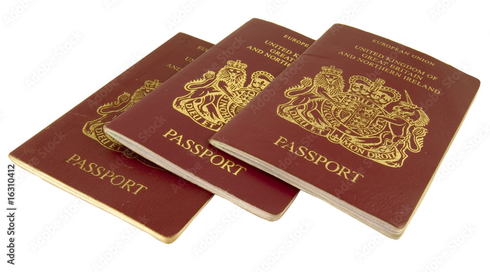 three british passports isolated on white background three british passports isolated on white background