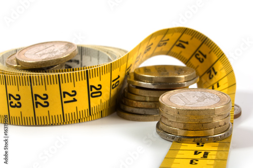 coins with metre on white photo