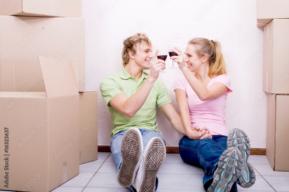 couple toasting to moving into new home together