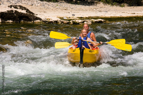 People on canoe photo