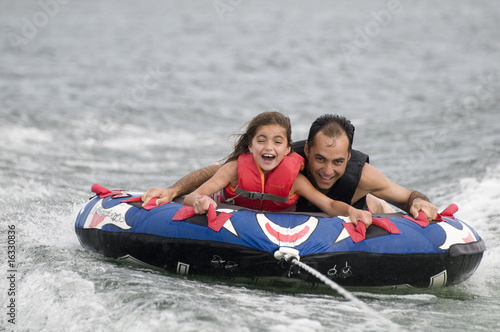 Father and daughter tubing