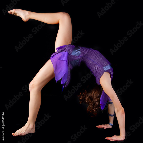 young yoga female doing yogatic exericise . photo