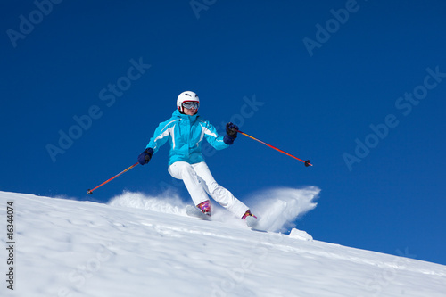 woman skiing on fresh snow