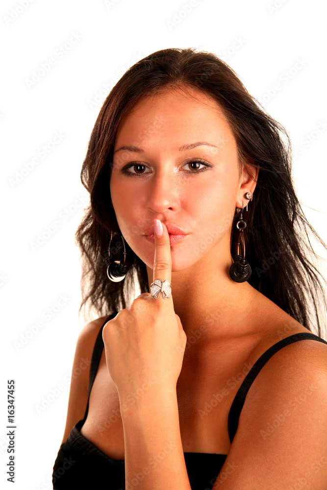 Beautiful brunette touched a finger to her lips Beautiful brunette touched a finger to her lips