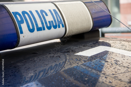 Polish police sign on a roof of polica car photo