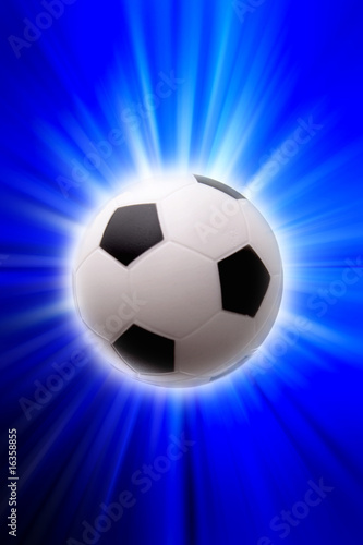 Football over blue and white background © Stillfx