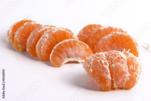 Tangerine slices. Selective focus on the front