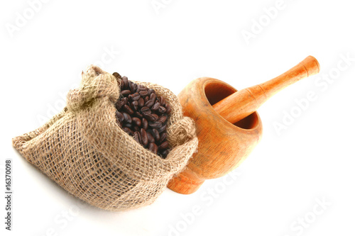 coffee bag full of beans with pestle
