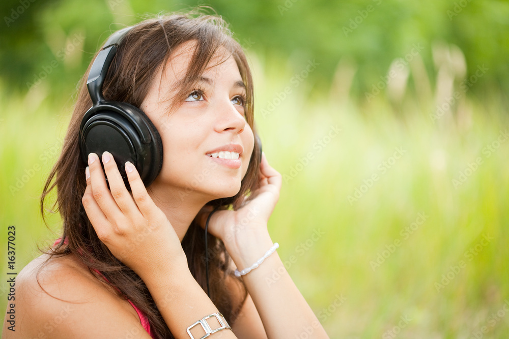 Young woman with headphones outdoor Young woman with headphones outdoor