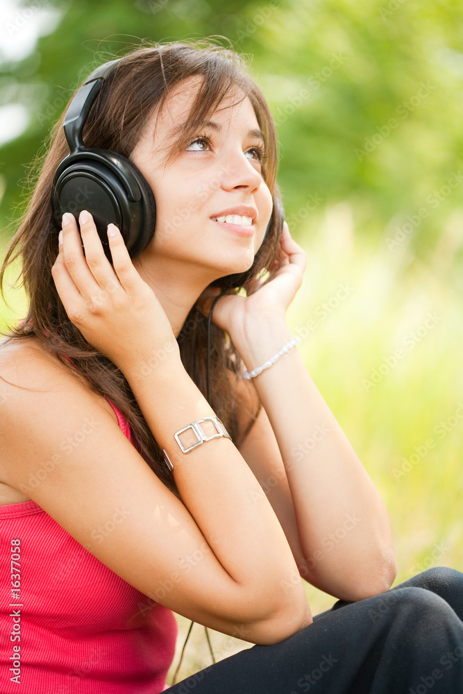 Young woman with headphones outdoor Young woman with headphones outdoor